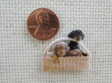 Second view of A Basket of Puppies Needle Minder.