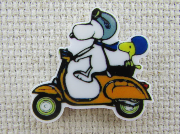 First view of Snoopy and Woodstock Riding a Scooter Needle Minder.
