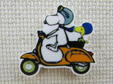 First view of Snoopy and Woodstock Riding a Scooter Needle Minder.
