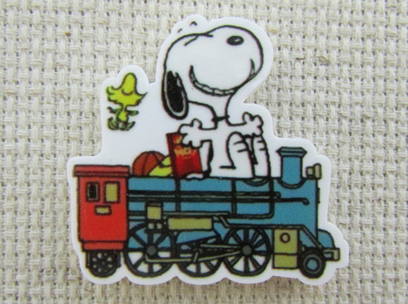 First view of Snoopy Riding on a Train Needle Minder.