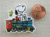 Second view of Snoopy Riding on a Train Needle Minder