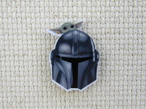 First view of Mandalorian Helmet with a Grogu Needle Minder.