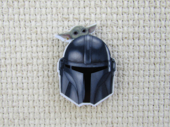 First view of Mandalorian Helmet with a Grogu Needle Minder.