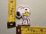Third view of the Snoopy Hugging Woodstock Needle Minder