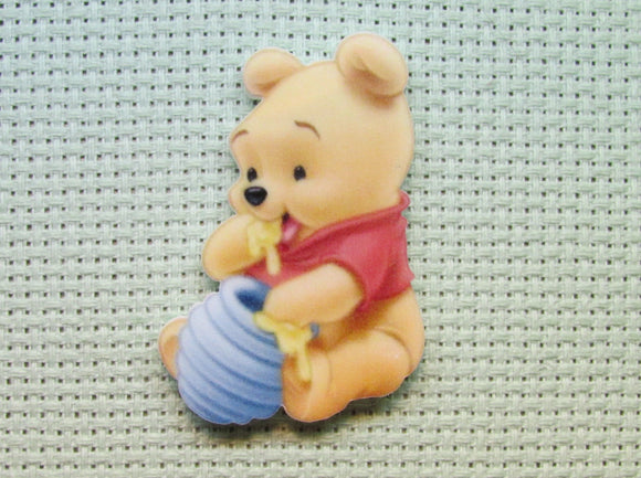First view of the Pooh Bear Eating Honey Needle Minder
