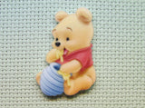 First view of the Pooh Bear Eating Honey Needle Minder
