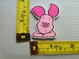 Third view of the Smiling Piglet Needle Minder